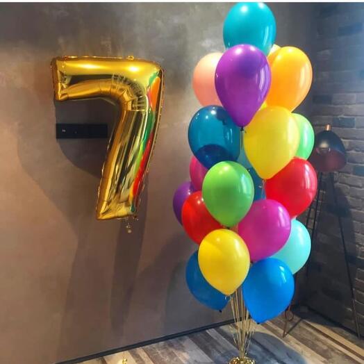 Gold number 7 balloon and colorful bunch of latex balloons