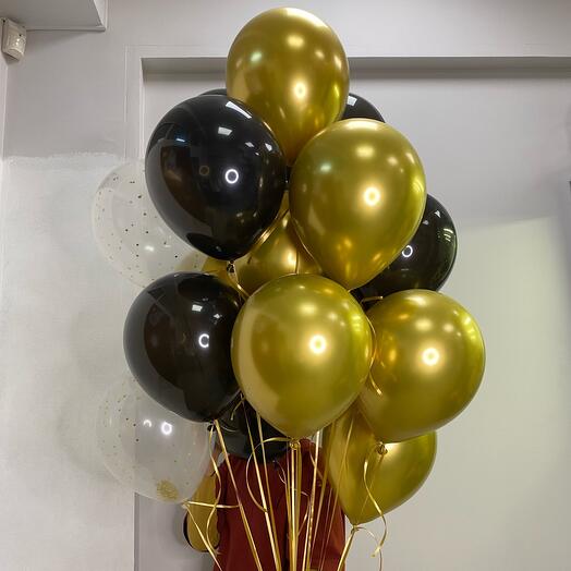 Bouquet of gold, black, and clear balloons