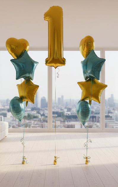 Gold and blue balloons shaped like hearts, stars and numbers.