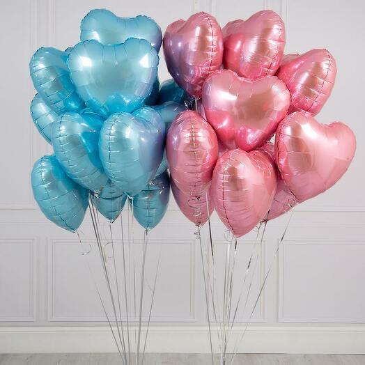 Bouquets of blue and pink heart-shaped balloons