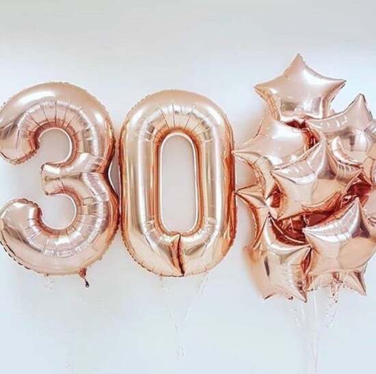 Rose gold '30' and star-shaped balloons in bouquet