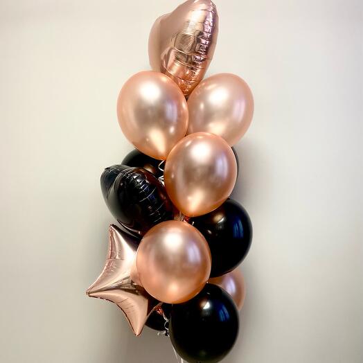 Decorative arrangement of balloons in rose gold and black