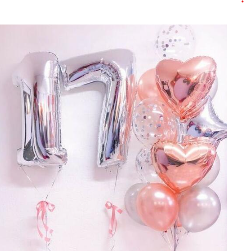 Silver number balloons spelling '11' with different shaped balloons in a bouquet