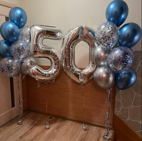 Silver '50' balloons with blue, silver and confetti balloons bouquets