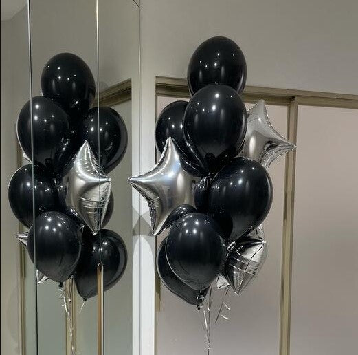 Black and silver balloons arranged in a decorative manner
