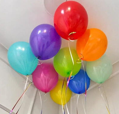 Ceiling decorated with bright multicolour helium balloons for celebrations